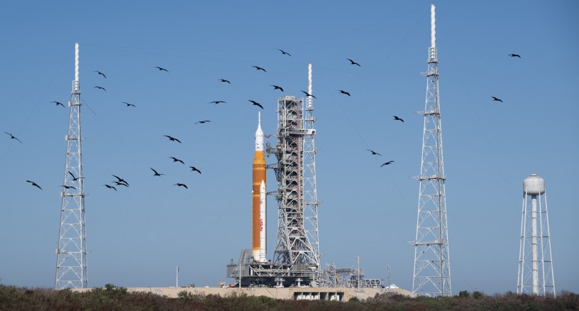 NASA’s Space Launch System (SLS) rocket and Orion spacecraft, secured to the mobile launcher, are seen as they arrive at Launch Pad 39B, Friday, March 20, 2026, at NASA’s Kennedy Space Center in Florida. NASA’s Artemis II test flight will take Commander Reid Wiseman, Pilot Victor Glover, and Mission Specialist Christina Koch from NASA, and Mission Specialist Jeremy Hansen from the CSA (Canadian Space Agency), around the Moon and back to Earth with launch opportunities beginning in April 2026. Photo Credit: (NASA/Joel Kowsky)
