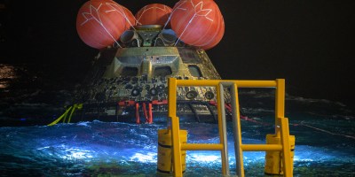 NASA’s Orion spacecraft is seen as the agency’s Landing and Recovery team, along with U.S. Navy personnel work to recover the spacecraft into the well deck of USS John P. Murtha in the Pacific Ocean off the coast of California, Saturday, April 11, 2026. NASA’s Artemis II mission, which took NASA astronauts Reid Wiseman, commander; Victor Glover, pilot; Christina Koch, mission specialist; and CSA (Canadian Space Agency) astronaut Jeremy Hansen, mission specialist on a 10-day journey around the Moon and back to Earth, splashed down at at 5:07 p.m. PDT (8:07 p.m. EDT). Photo Credit: (NASA/Bill Ingalls)