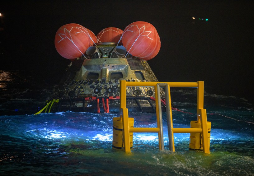 NASA’s Orion spacecraft is seen as the agency’s Landing and Recovery team, along with U.S. Navy personnel work to recover the spacecraft into the well deck of USS John P. Murtha in the Pacific Ocean off the coast of California, Saturday, April 11, 2026. NASA’s Artemis II mission, which took NASA astronauts Reid Wiseman, commander; Victor Glover, pilot; Christina Koch, mission specialist; and CSA (Canadian Space Agency) astronaut Jeremy Hansen, mission specialist on a 10-day journey around the Moon and back to Earth, splashed down at at 5:07 p.m. PDT (8:07 p.m. EDT). Photo Credit: (NASA/Bill Ingalls)