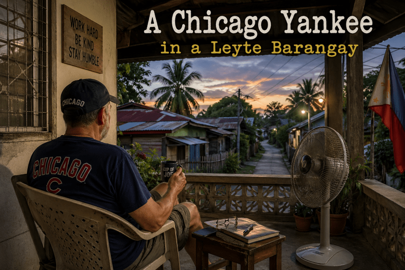 American man wearing a Chicago Cubs shirt sitting on a porch in a Leyte barangay, Philippines, at dusk with a quiet rural street in the background