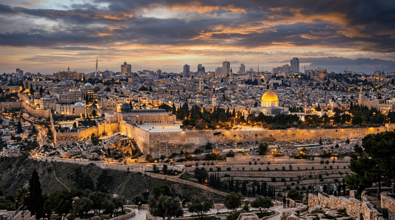 Jerusalem cityscape with Dome of the Rock and city lights at twilight