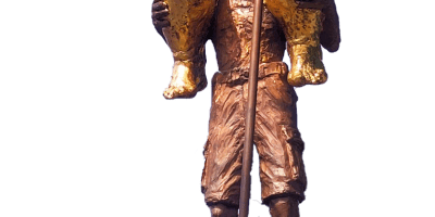 Danish artist Jens Galschiøt's sculpture The Orange Plague depicts a large, naked, gold-covered Donald Trump holding scales of justice and a golf club while sitting on the shoulders of a smaller, struggling bronze-colored man. The sculpture stands on a black pedestal bearing the words “THE ORANGE PLAGUE.”